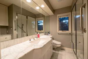 Second bathroom off Primary suite with steam shower and bidet