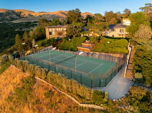 View of tennis court featuring a mountain view