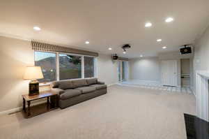 Family room with gorgeous views, walkout basement, fireplace, drop down screen, projector and speakers