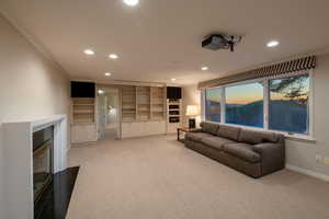 Family room with gorgeous views, walkout basement, fireplace, drop down screen, projector and speakers