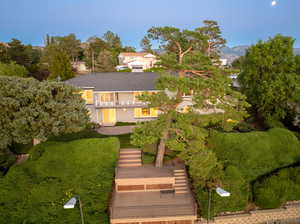 Aerial shot of back of home with deck