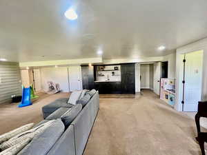 Living room featuring light colored carpet