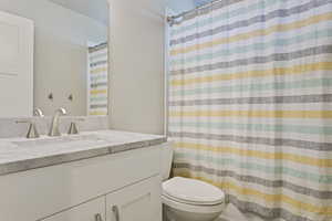 Bathroom with vanity and toilet