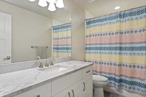 Bathroom featuring toilet and vanity