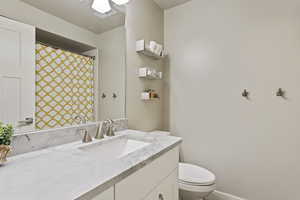 Bathroom with toilet and vanity