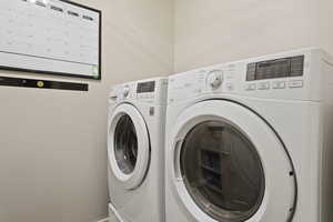 Laundry room featuring separate washer and dryer