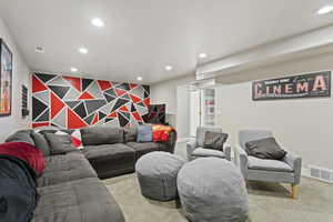 Living room featuring light colored carpet