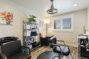 Home office with light wood-type flooring