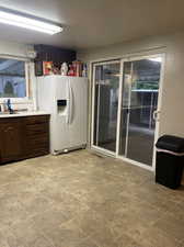 Washroom featuring light tile patterned flooring and sink