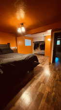 Bedroom featuring a textured ceiling and hardwood / wood-style floors