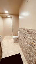 Bathroom featuring tile patterned flooring, toilet, and vanity