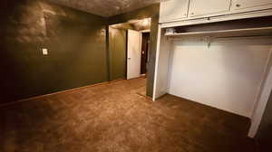 Unfurnished bedroom with a closet and light colored carpet