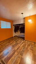 Spare room with hardwood / wood-style flooring and a textured ceiling