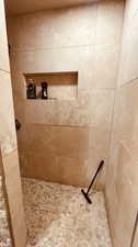 Bathroom with tiled shower