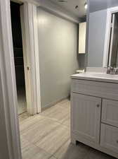 Bathroom featuring tile patterned floors and vanity