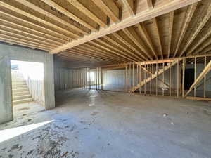 View of unfinished basement area for future rec room with basement entrance