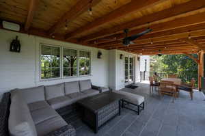 View of patio with ceiling fan, french doors, and an outdoor hangout area