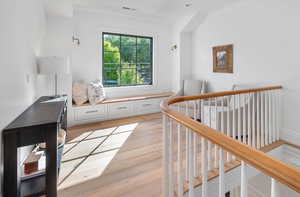 Interior space featuring light hardwood / wood-style flooring and ornamental molding.  Great views of Mount Olympus