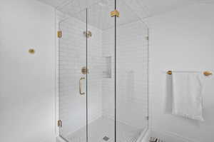 Bathroom with a shower with door