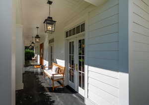 Doorway to property with covered porch