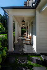 Doorway to property with covered porch