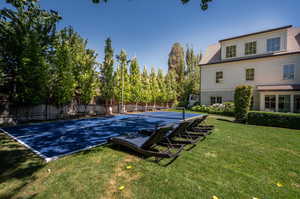 View of pickle ball court with large grass area