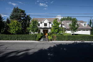 View of front facade featuring a garage