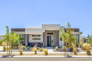 Contemporary house featuring stucco siding