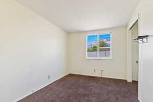 Unfurnished bedroom featuring carpet floors and a closet