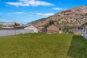 View of yard featuring a mountain view. *Lawn has been virtually enhanced.