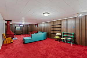 Interior space with wooden walls and carpet flooring