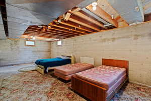 Bedroom featuring concrete flooring