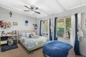 Carpeted bedroom #5 featuring ceiling fan and lofted ceiling with beams