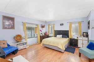 Master Bedroom featuring light hardwood / wood-style flooring and cooling unit