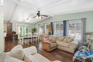 Living room with dark hardwood / wood-style flooring, vaulted ceiling with beams, wine cooler, and ceiling fan