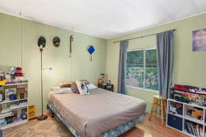 Bedroom # 2 featuring light wood-type flooring