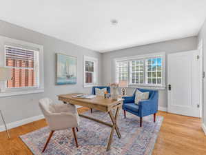 Office space featuring light wood-type flooring