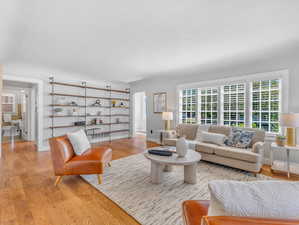 Living room with light hardwood / wood-style flooring