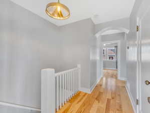 Hall featuring light hardwood / wood-style flooring