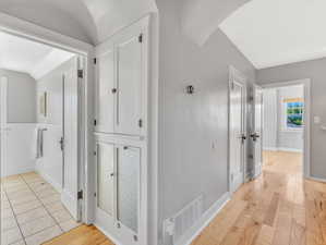 Hall featuring light hardwood / wood-style flooring