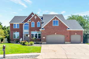 View of property with a front lawn