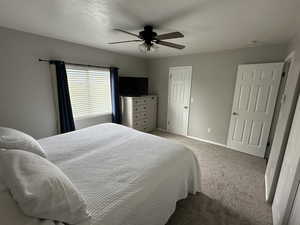 Bedroom featuring carpet floors and ceiling fan