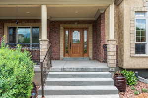 Property entrance featuring covered porch