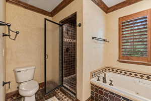 Bathroom with shower with separate bathtub, tile patterned floors, a textured ceiling, crown molding, and toilet