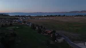 Aerial view at dusk with a water and mountain view