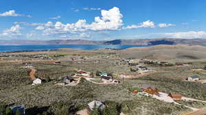 Aerial view featuring a water and mountain view