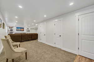 Sitting room with light hardwood / wood-style flooring