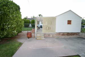 Lower patio and back of garage & carport or upper patio