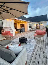 Wooden terrace with an outdoor hangout area