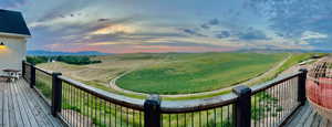 Balcony at dusk with a rural view and a mountain view